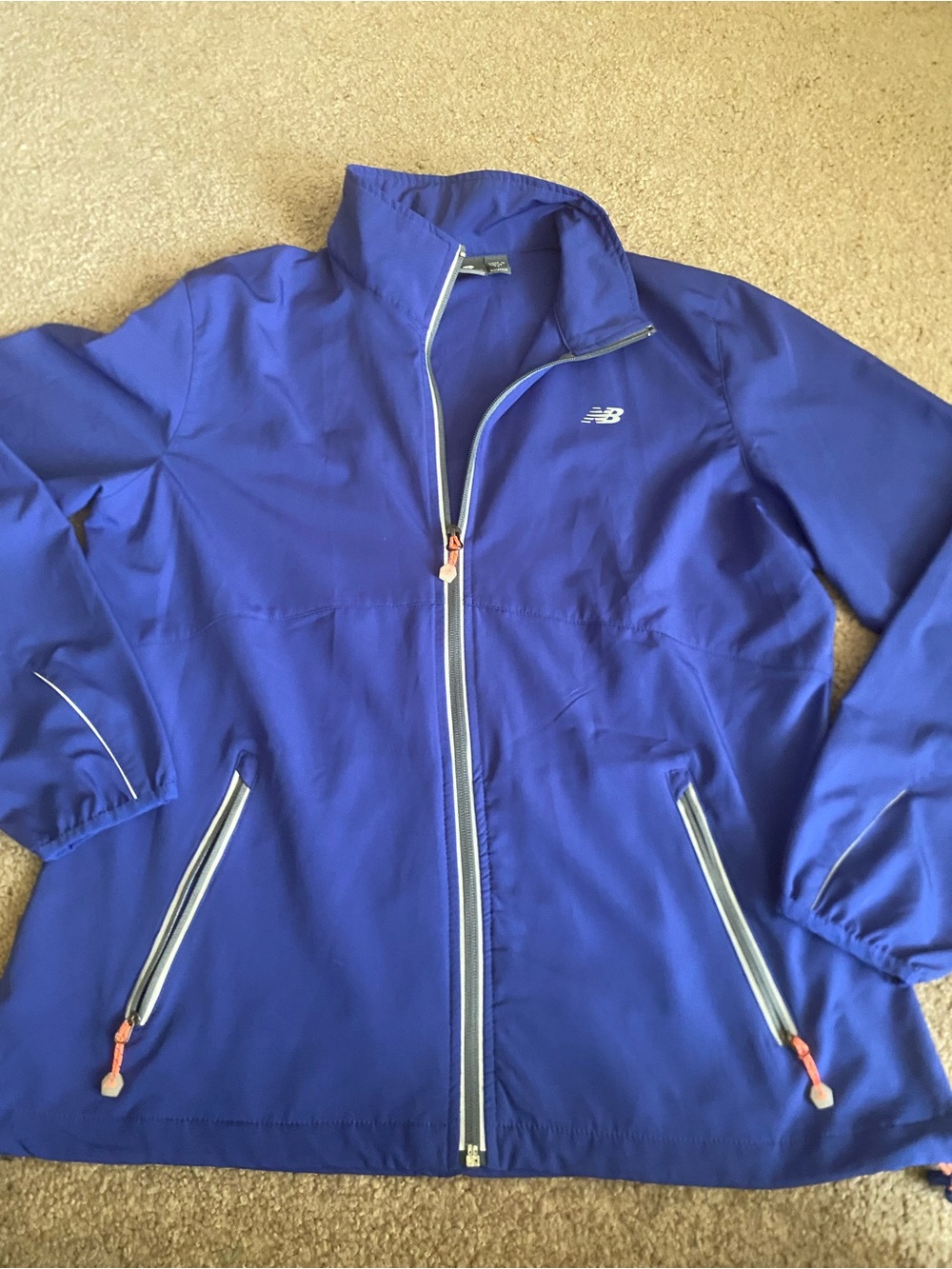 New Balance women's full-zip athletic windbreaker jacket